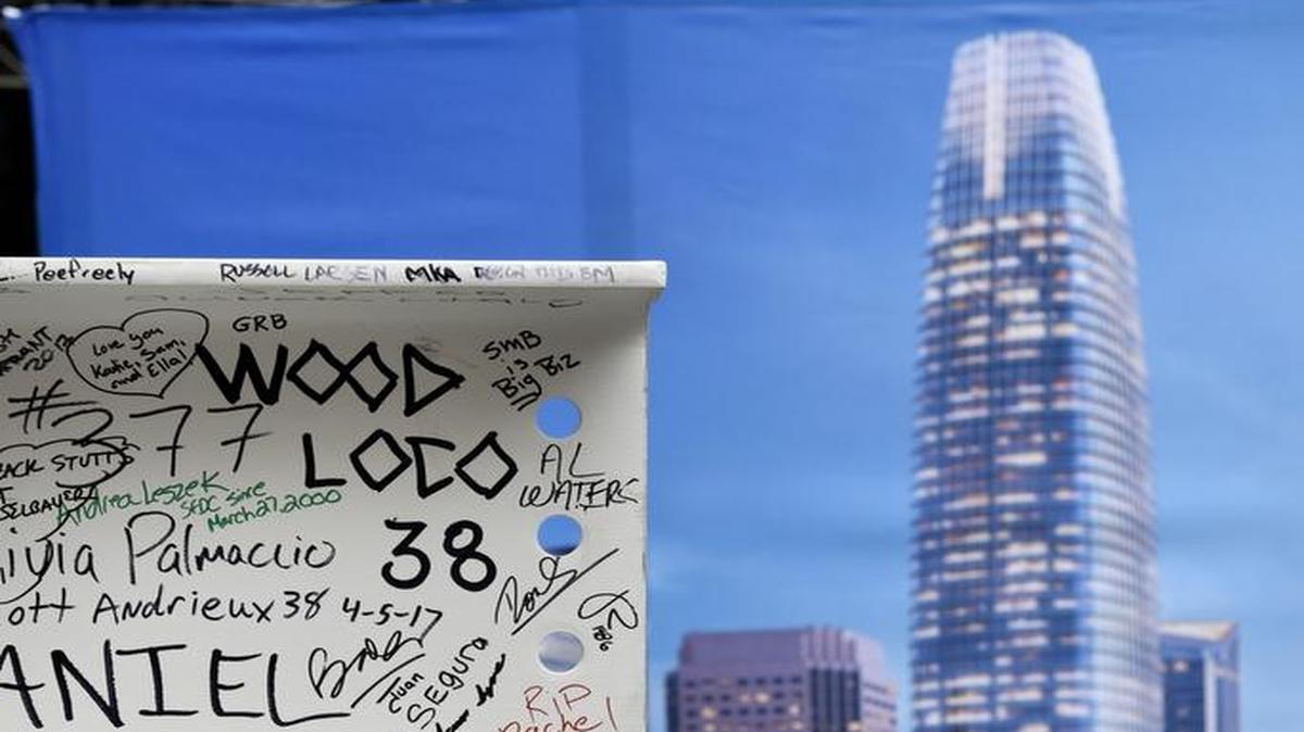 The final steel beam stands in from of a poster during a topping-off ceremony for the Salesforce Tower in San Francisco on April 6, 2017. The Salesforce Tower, officially the tallest occupiable building west of Chicago, is 61 stories high and is expected to be completed in 2017.