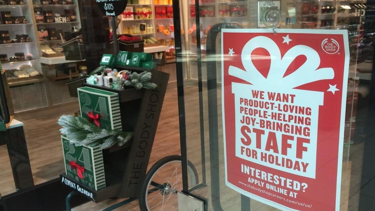 A sign on the front window of The Body Shop in Fresno’s Fashion Fair mall beckons would-be workers to apply for seasonal holiday jobs. The store, which sells hair-and-skin-care products, plans to hire five temporary employees for the holiday season.