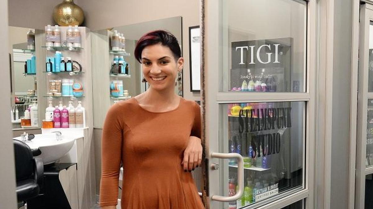 Ashley Gann, owner of Steam Spunk Studio, stands outside her suite in the Sola Salon Studios in Fresno on Friday, Oct. 28, 2106. The facility houses individual suites for stylists, manicurists, estheticians, barbers and others.