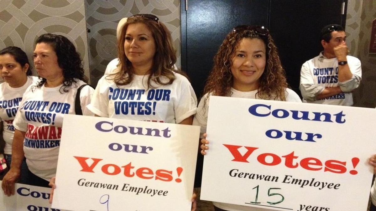 Lourdes Dominguez, a Gerawan employee, stands in the middle. She was among about 200 workers who attended a rally at the Radisson Hotel in Fresno to pressure the Agricultural Labor Relations Board to count the ballots in an election that would no longer make the United Farm Workers union their bargaining representative.