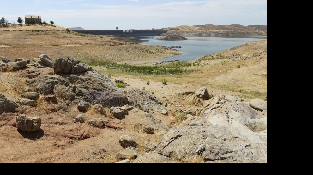 

A drawn-down Millerton Lake behind Friant Dam in late June
