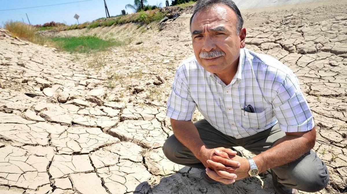 Gary Serrato, general manager of the Fresno Irrigation District, in a dry waterway during the summer of 2015. The 2016 water delivery year has been better than any of the previous four, Serrato announced.