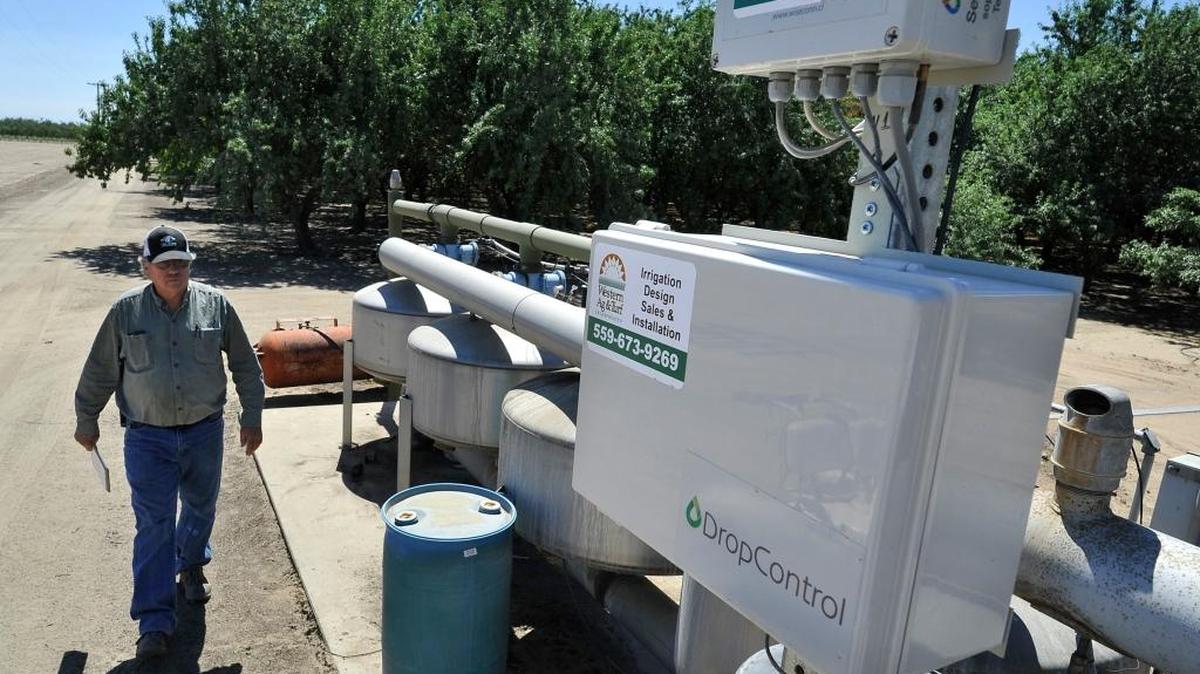 Tom Rogers, a Madera County almond farmer, uses an electronic control center to irrigate his trees remotely and effectively.