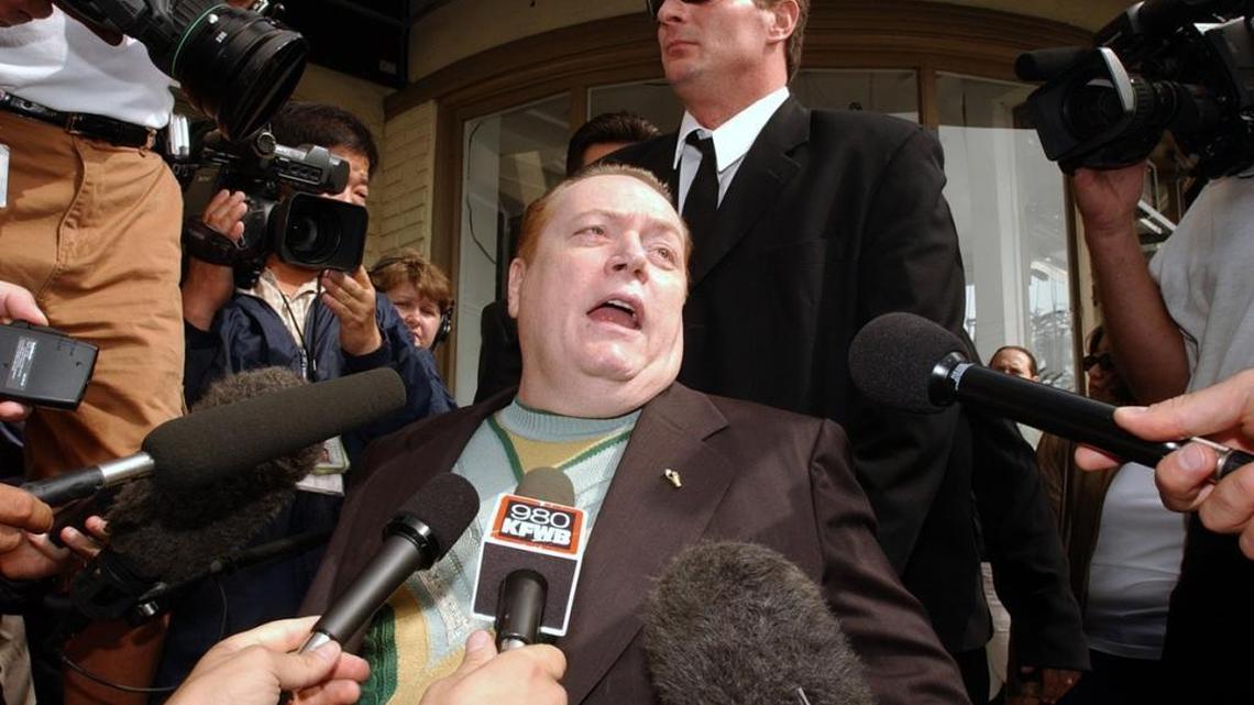 In an October 2003 file photo, Hustler magazine publisher Larry Flynt talks to reporters as he arrives to cast his vote in the California gubernatorial recall election. Flynt was a candidate. He is scheduled to appear this month at the grand opening of a Hustler Hollywood boutique in Fresno.