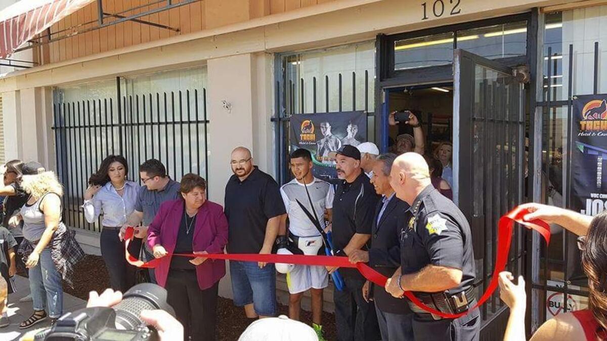 California High-Speed Rail Authority Director Diana Gomez, Main Event owner Al Perez, Fresno County Supervisor Henry Perea and Fresno police Chief Jerry Dyer cut the ribbon on Main Event Boxing’s new location on June 18, 2016.