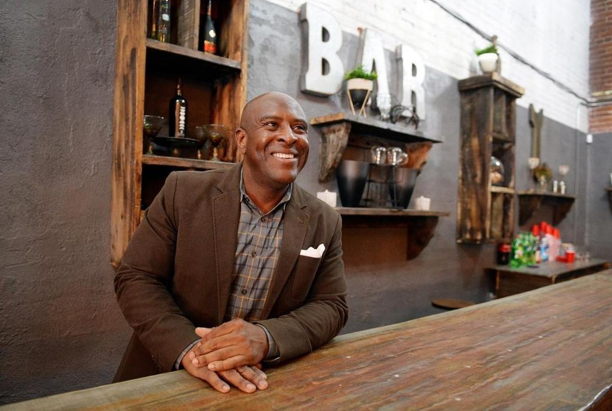 Developer Terance Frazier stands behind the bar in one of the rooms in his Broadway Event Center, located just south of Chukchansi Park, on Tuesday, Dec. 5, 2017. The center features large warehouse rooms for corporate events or parties. It is possibly the first step to realizing Frazier's dream of creating a housing, retail and entertainment superblock near Chukchansi Park.