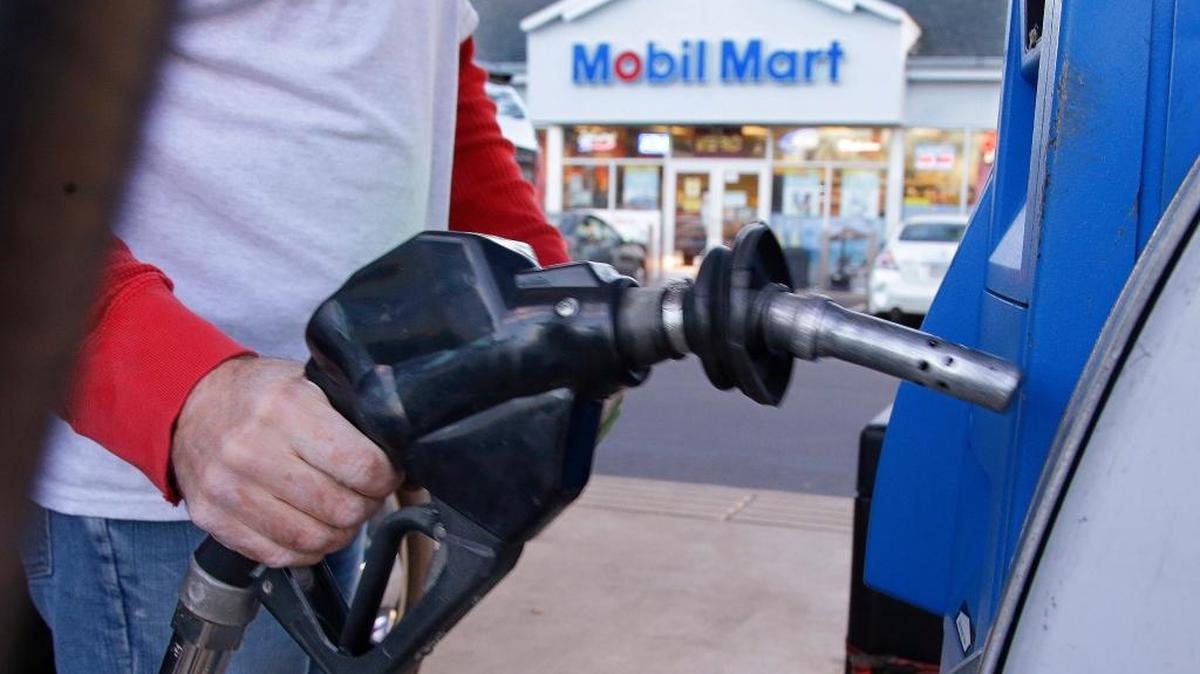 A customer prepares to pump gas on Monday, Dec. 7, 2015, at a gas station in Pembroke, Mass. Gas prices are creeping up in Fresno and the Valley due to refinery issues.