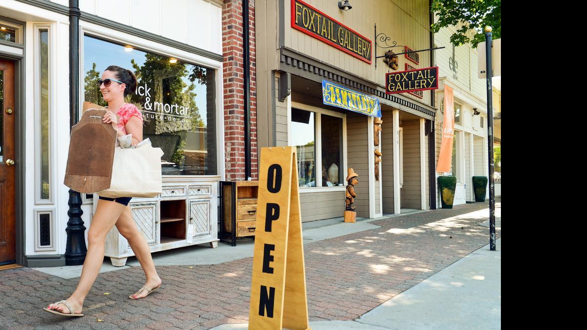 
The city of Clovis has launched a new website aimed at growing local businesses and attracting new ones. Chelsea Alameda shops in Old Town Clovis Wednesday, July 16, 2014. 
