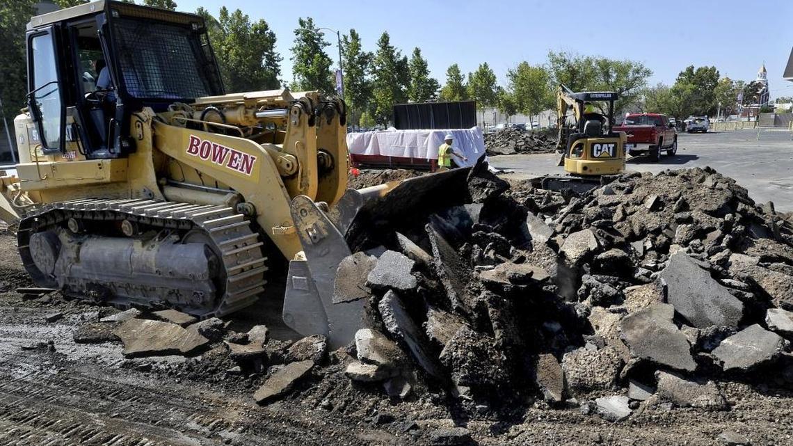 
A heavy front-end loader rips up part of the Selland Arena parking lot at Fresno and O streets during the first round of work on the new site of Cosmopolitan, which is being moving from its longtime site at Fresno and G streets as part of the high-speed rail work. 
