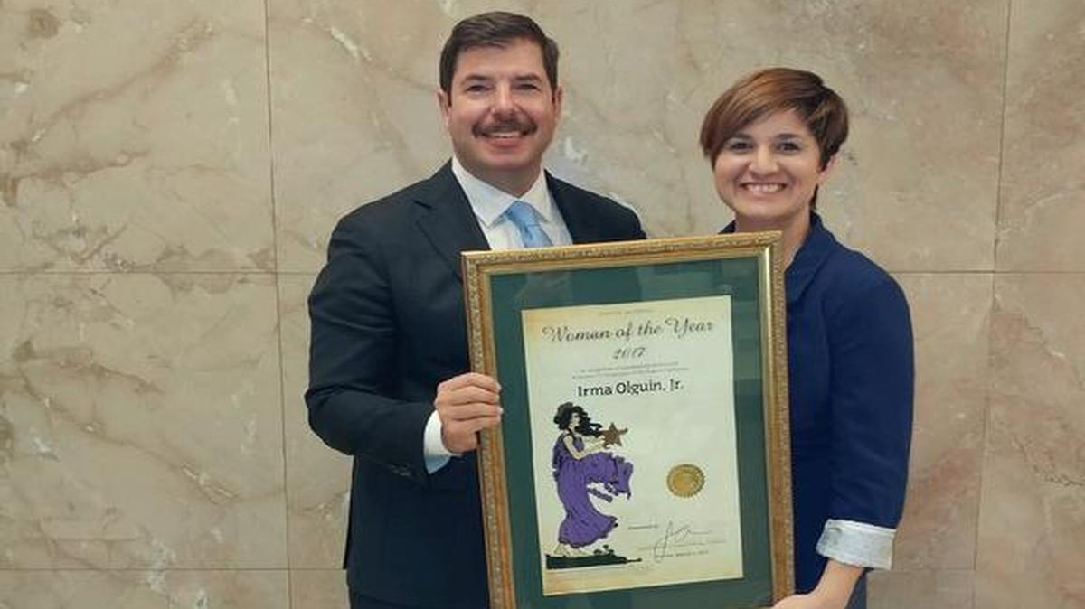 Irma Olguin, co-founder of Bitwise Industries in Fresno, receives the Woman of the Year award from Assemblyman Dr. Joaquin Arambula.