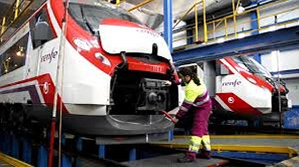 
A worker services a Renfe train at a maintenance depot in Spain. Communities in the San Joaquin Valley are competing to be selected as a site for a heavy maintenance facility for California’s high-speed rail project.
