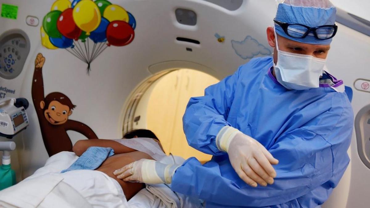 Pediatric interventional radiologist Trevor Davis finishes a surgery at Valley Children’s Hospital Tuesday, Feb. 7, 2017.