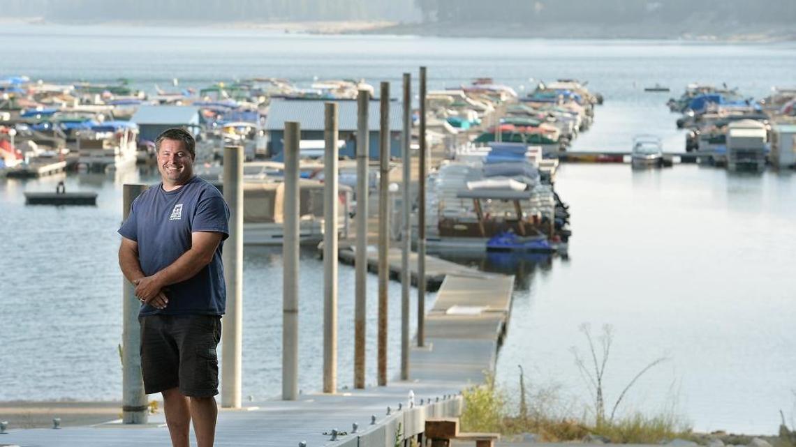 
Sierra Marina owner Sheldon Sandstrom, 47, of Fresno, stands on the dock which rests partly on top of the boat ramp at Shaver Lake. “Hope for the best, plan for the worst, pray for the best,” says Sandstrom, whose family has owned the business for the last 32 years and weathered the drought back in 1987-88 when he says the lake dropped to 17 percent capacity. “Last year was our second-best year ever and this year might be the third-best year, “ he says. Although the water level has dropped to 38 feet below normal, Sandstrom says that the usable surface area is at 85 percent of normal partly due to the lake’s shape.
