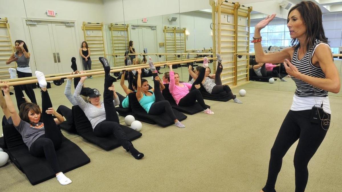 Owner/instructor Jennifer Hoekstra leads a class at The Bar Method.
