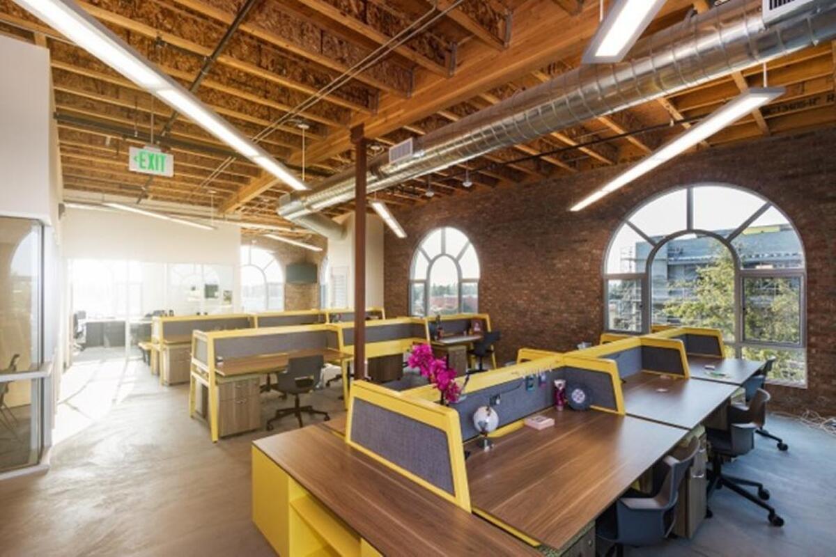 Realtor desks inside the Realty Concepts office on the third floor of the company’s new building on Pollasky Avenue in Old Town Clovis.