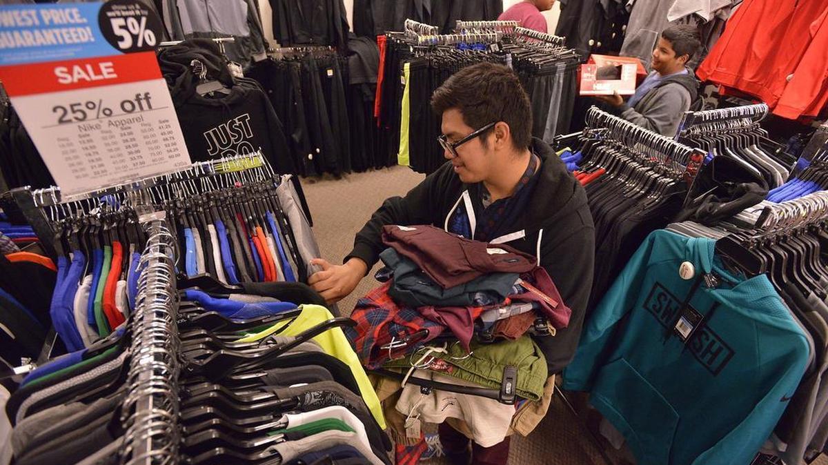Juan Morales, 20, of Fresno, takes advantage of early Black Friday sales at JCPenney at Fashion Fair in November 2016. The retailer is planning to close 130 to 140 stores in the next few months.