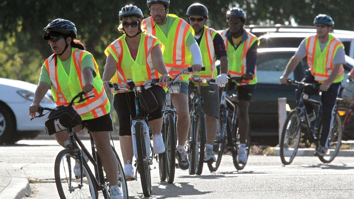
Caltrans employees cross Blackstone Avenue head to work during the Bike to Work Corporate Challenge in May 2010.
