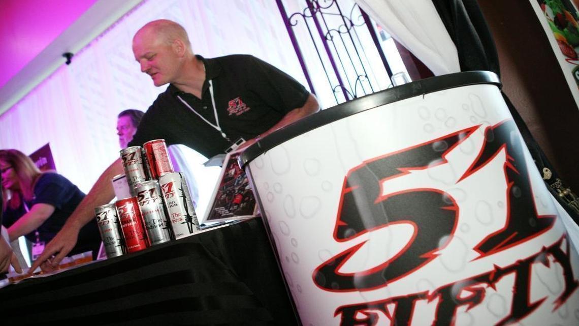 Dennis Kowalkowski of 51FIFTY energy drinks gives out information to visitors during the Fresno Food Expo new products/People’s Choice award event in 2013.