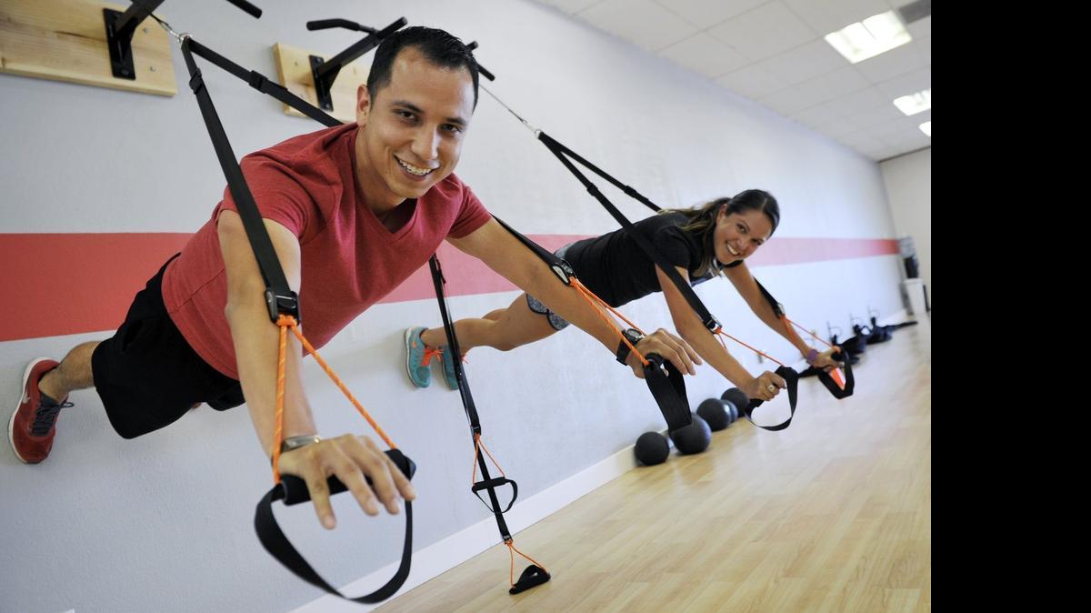 
Nestor Flores, left, and his assistant Sam Jaramillo, right, of Fresno Fit, show off their new and bigger location that opened for business  July 20 at Bullard and Marks Avenue. Flores said the grand opening will take place July 31.
