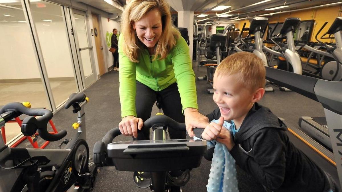 Xcelerate Fitness Underground co-owner Cheri Bertelsen, left, demonstrates the Freemotor Le Tour de France stationary bike with 4-year-old grandson Gabriel, inside the new downtown gym on Wednesday, Dec. 30, 2015 in the basement of the Bitwise South Stadium building in downtown Fresno. The new gym, which is set to open on Jan. 4, 2016, includes cardio machines, elliptical machines, stationary bikes, weight machines, plate-loaded equipment, free weights and showers.