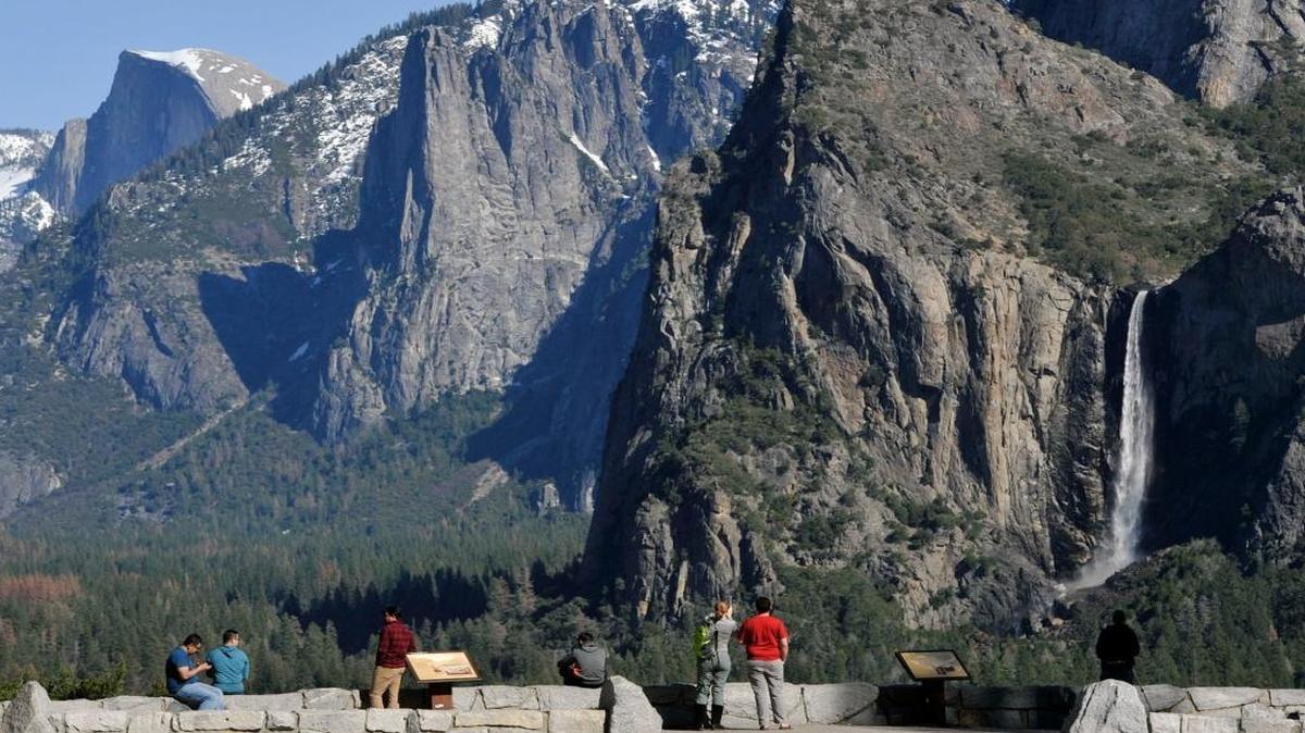 Tourists enjoy the view of Yosemite Valley from Valley View in Yosemite National Park in this February photo. The park is a major factor in tourism for the central San Joaquin Valley.