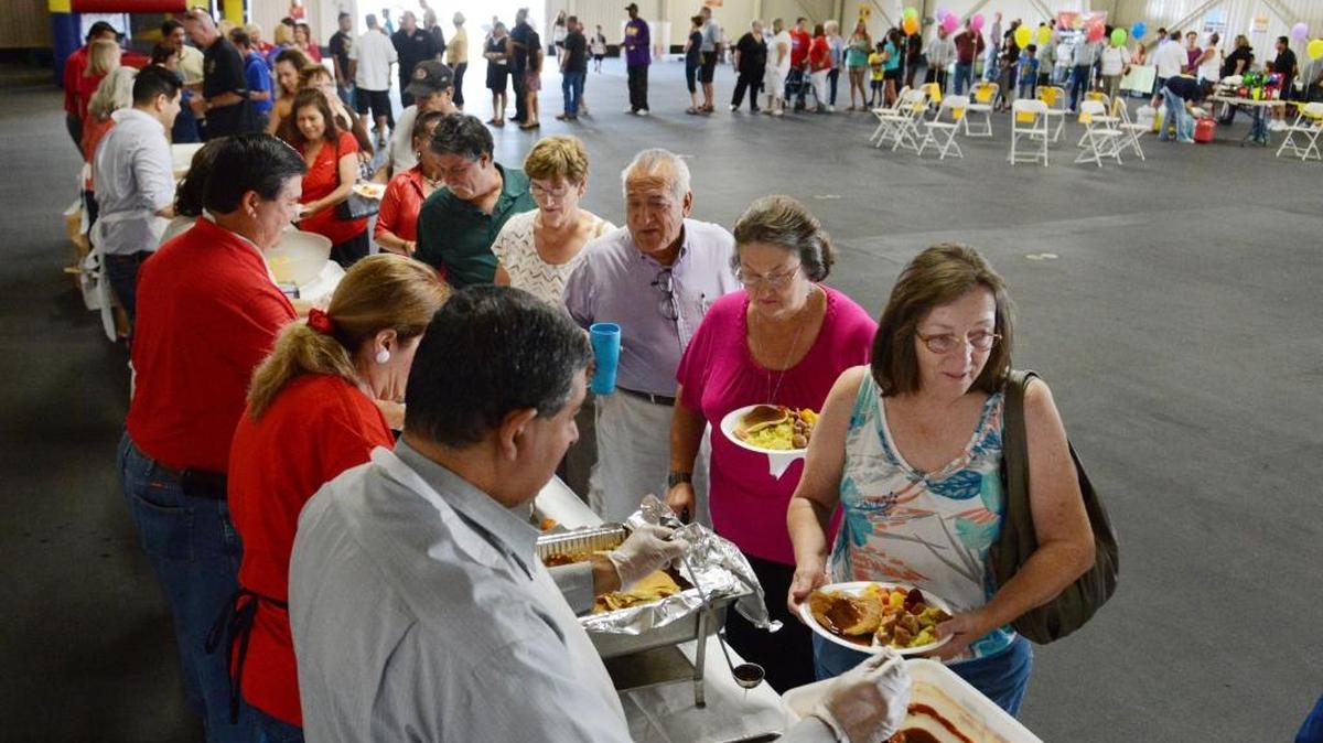 
Attendees make their way through a long line at the annual Labor Day Pancake Breakfast at the Fresno Fairgrounds in 2013. This year’s breakfast runs from 8 a.m. to 10 a.m. Monday, with the dedication of a workers memorial after breakfast.
