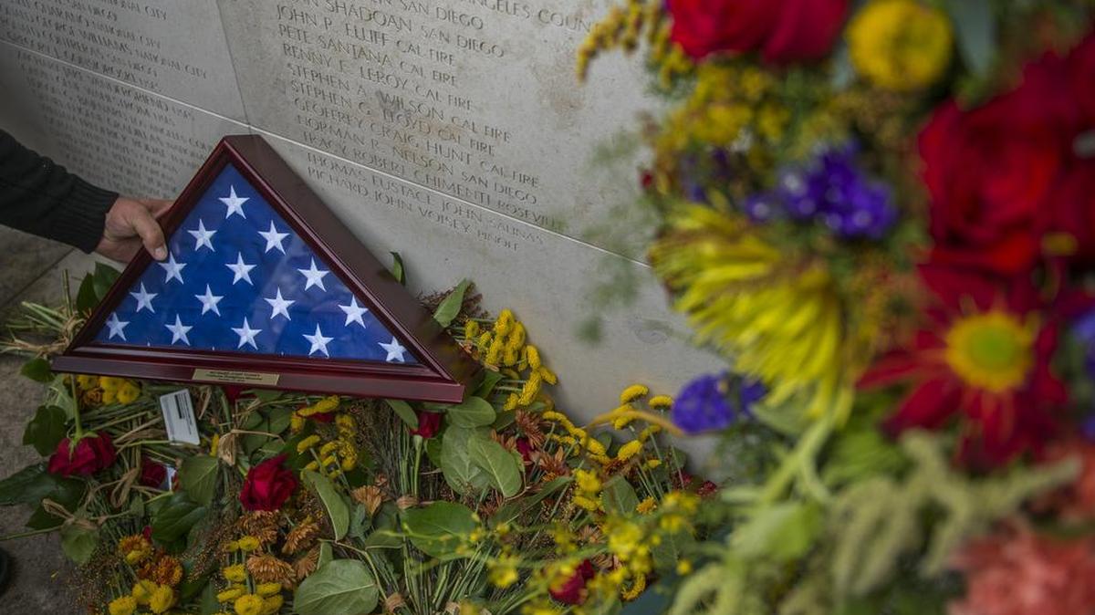Richard Voisey, a firefighter with Pinole fire, is remembered at the California Firefighters Memorial on Saturday, Oct. 17, 2015, at the Capitol Park in Sacramento, Calif.