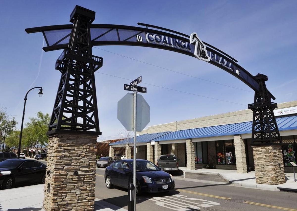 An arch at the intersection of West Elm Avenue and Coalinga Plaza heralds the oil industry with its design elements, seen on Wednesday, March 9, 2016 in Coalinga, Calif. The city is turning its closed Claremont Custody Center facility into a marijuana oil cultivation facility.