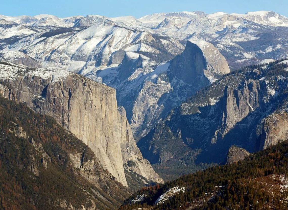 El Capitan, left, and Half Dome are seen in Yosemite Valley from the perspective of a helicopter looking east toward the Sierra Nevada mountains in this Fresno Bee file photo.