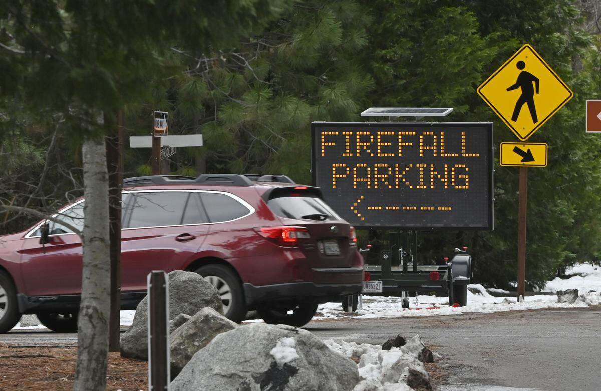 A visitor pulls into parking specifically designated for Firefall viewing in Yosemite Valley Friday, Feb 9, 2024, in Yosemite National Park. 