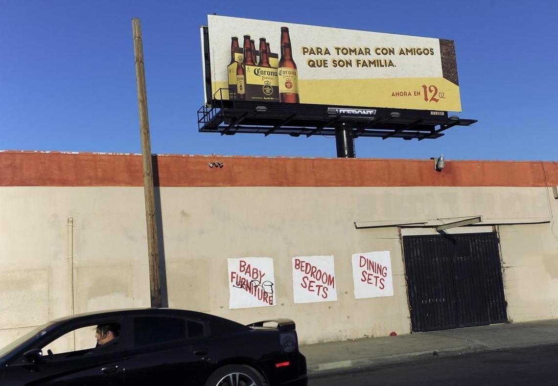 Pastor Elias Loera of Christian Temple says promotion of alcohol is often delivered in Spanish, such as this billboard off Kings Canyon Road.