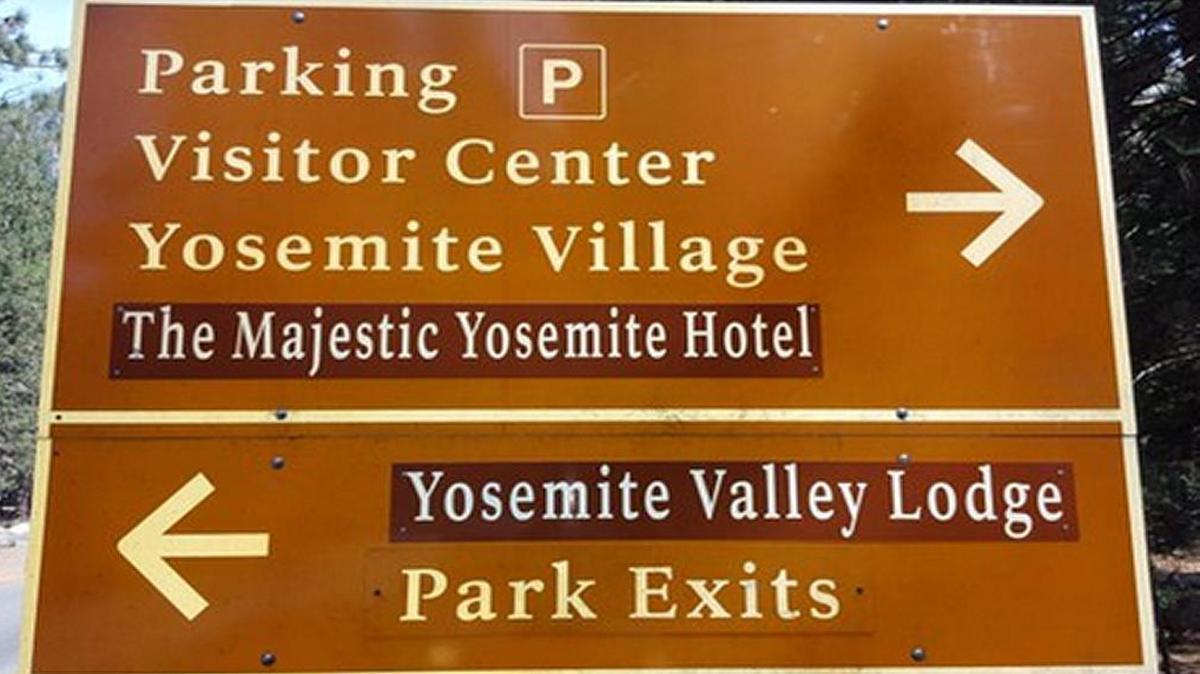 A traffic sign in Yosemite National Park was changed Tuesday, March 1, 2016 to reflect new names for The Ahwahnee hotel and Yosemite Lodge at the Falls. The changes were made because of a trademark dispute between the National Park Service and Yosemite’s former concessionaire, Delaware North.
