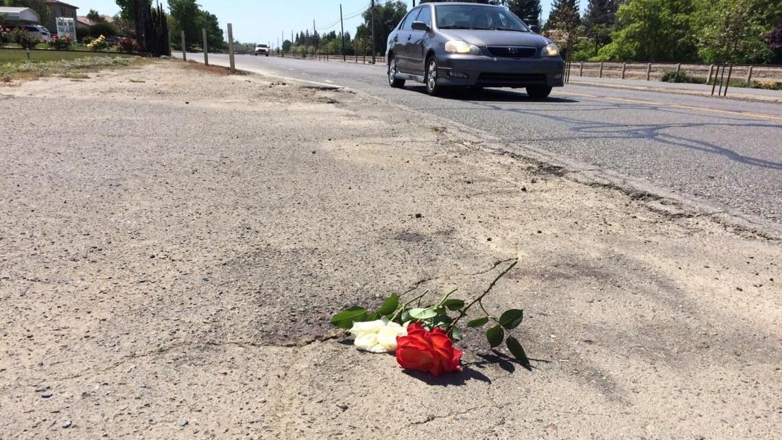 A Visalia homeowner placed roses at the spot where a 92-year-old bicyclist fell after colliding with a trailer pulled by truck. Robert Seymour died as a result of injuries in the accident on Monday morning, April 4, 2016.