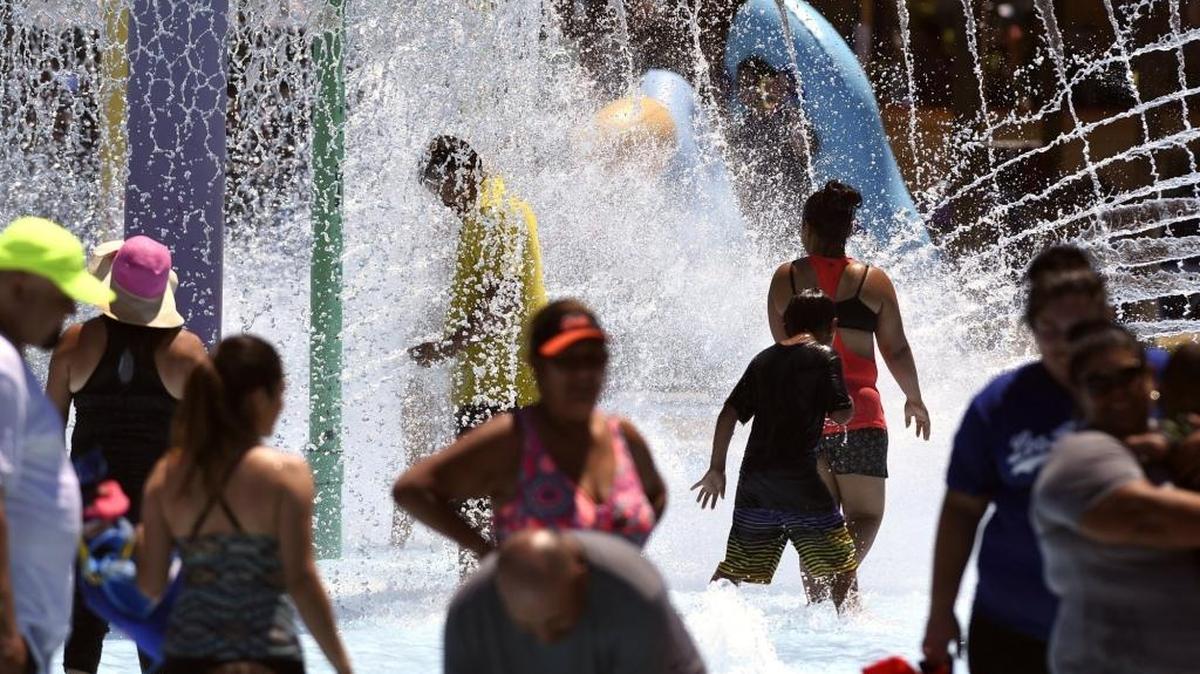Crowds cool off at Island Waterpark, one of several water parks in the area Sunday afternoon in Fresno as triple digit temperatures continued with no relief in sight.