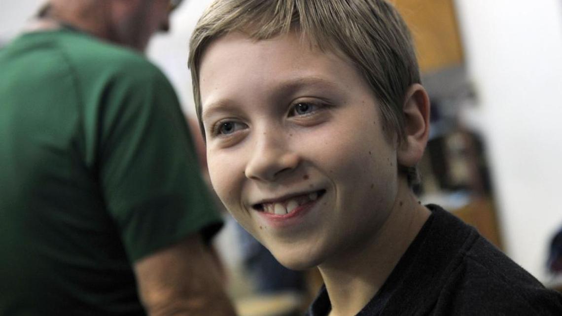 Anthony Wainess, 11, of Squaw Valley smiles during a lull in slot car racing Wednesday, Feb. 10, 2016 in Clovis, Calif. Anthony is the first person in the United States to have experimental spine implants in his back to help with severe scoliosis.