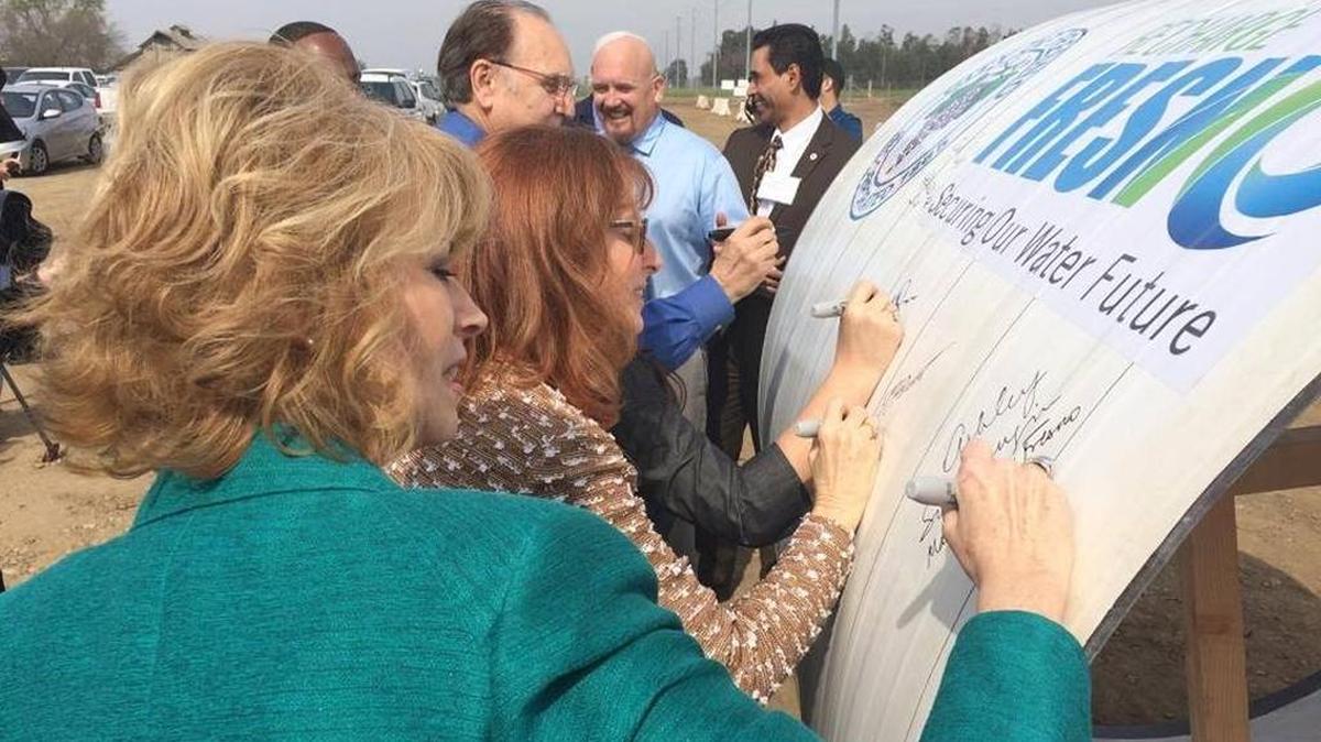 Fresno Mayor Ashley Swearengin and other dignitaries sign a ceremonial section of pipe at the groundbreaking for a new water treatment plant in this March 2016 file photo. New water mains will connect the Southeast Surface Water Treatment Plant to the city’s existing water supply system.