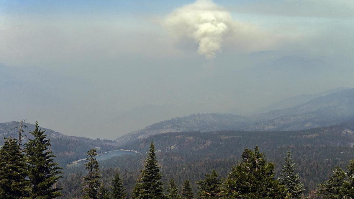 
Smoke billows up from the Rough fire on Aug. 24 as seen from Panoramic Point while Hume Lake is at lower left. 
