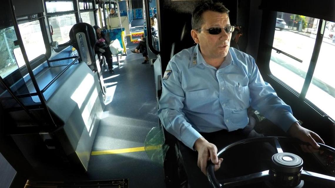 FAX Q bus driver Jeff Thompson at the wheel during the inaugural run Monday morning, Feb. 19, 2018.
