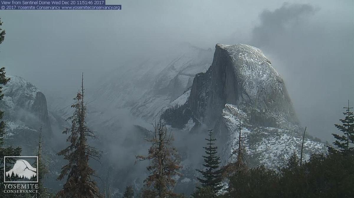 The high Sierra webcam operated by the Yosemite Conservancy shows snow dusting Half Dome and adjacent ridges around noon on Wednesday.