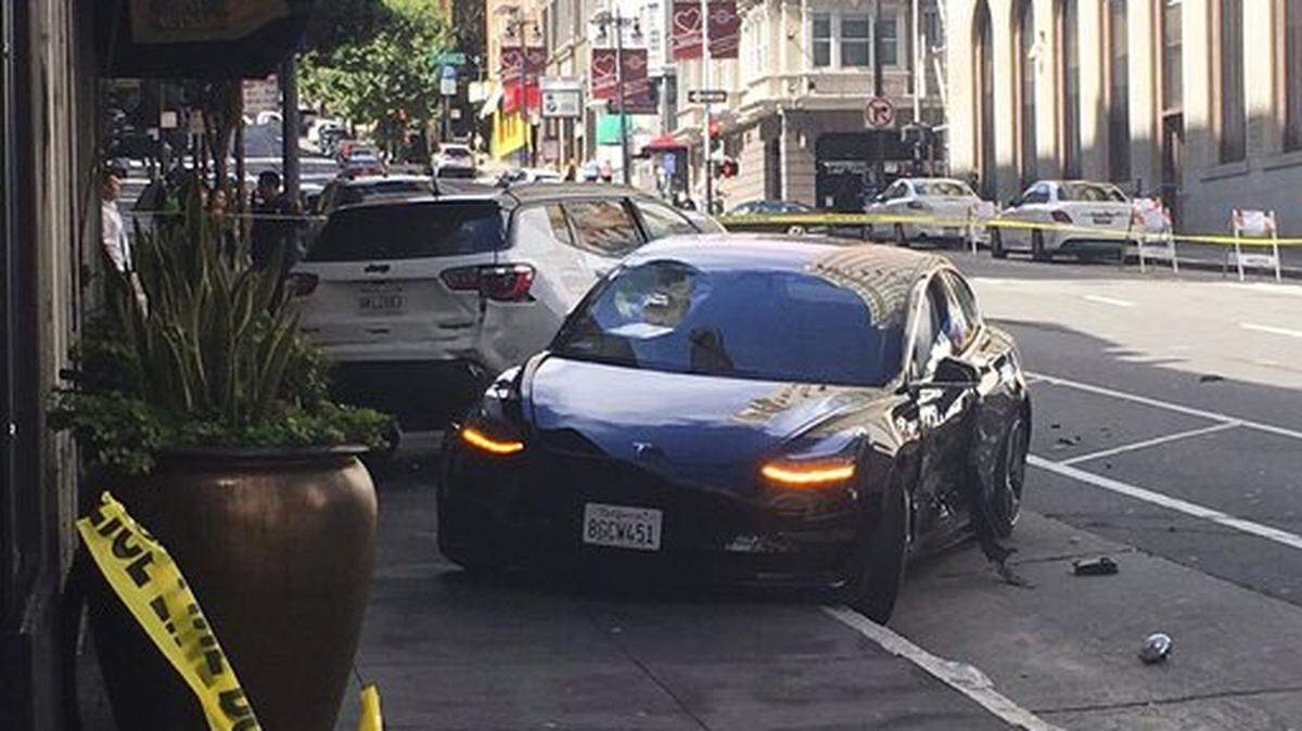 This photo taken Sunday, July 21, 2019, and provided by KGO-TV shows the scene after a woman was arrested after running a red light in a rented Tesla in San Francisco and causing a crash that killed a tourist and left his wife critically injured. Officers were investigating whether the Tesla, which was rented through the peer-to-peer car rental service Get Around, was operating on self-driving mode, police said in a statement Monday, July 22, 2019.