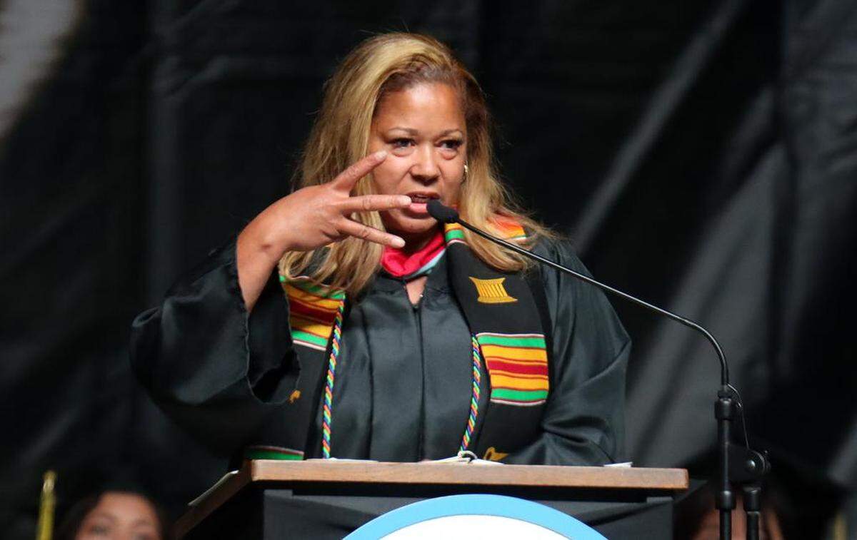 Fresno Unified School District Trustee Keisha Thomas addressed the graduates, then threw a few T-shirts with money in them to the grads, at the Edison High School graduation ceremony at the Save Mart Center on June 5, 2023.