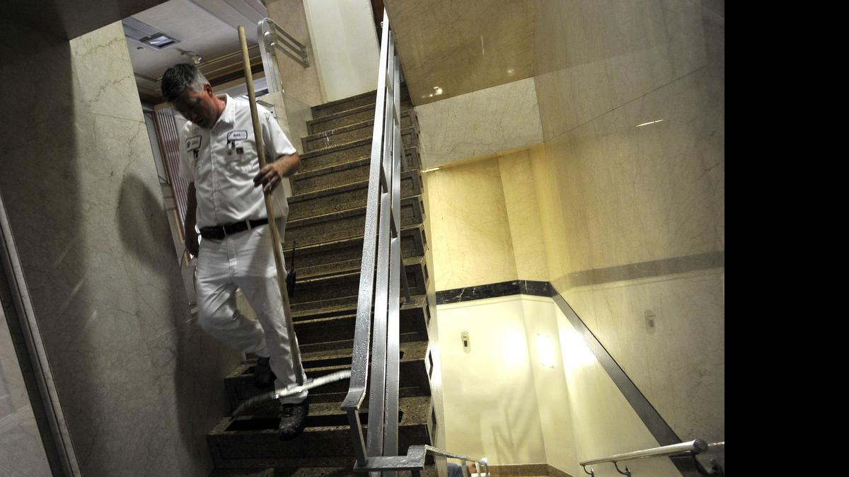 
A worker emerges from an upper floor of the Hall of Records after the building was closed Monday because of a broken pipe. 
