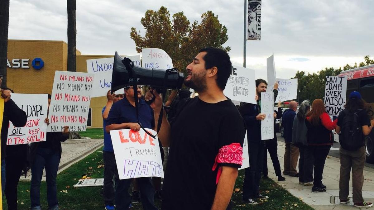 Sixty-five protesters gathered at Blackstone and Nees avenues near River Park Saturday afternoon to march against president-elect Donald Trump and his statements against Mexicans and immigrants.