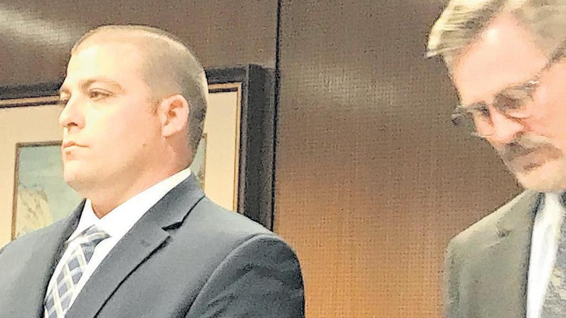 Former Fresno County Sheriff’s detective Jared Mullis, left, appears in court with Fresno lawyer Roger Wilson.