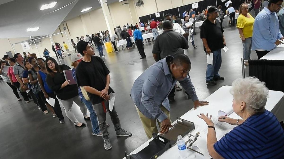 People wait in line at the annual Big Fresno Fair job fair last August.