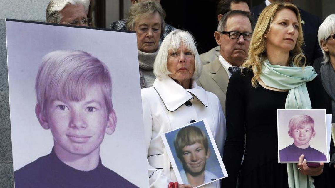 In this April 8, 2015 file photo, Kathryn Groves, left, the mother of murder victim Michael Morganti, holds hands with her daughter, Vikki Van Duyne, at a Capitol news conference calling for Gov. Jerry Brown to reject the parole of his killer, in Sacramento, Calif. Gov. Jerry Brown is blocking parole for the killer of Morganti, a developmentally disabled California man who was buried alive. Brown decided Friday, June 26, 2015, that 52-year-old David Weidert still is too dangerous to be released, despite the recommendation by a state panel that parole should be granted. (AP Photo/Rich Pedroncelli, File)