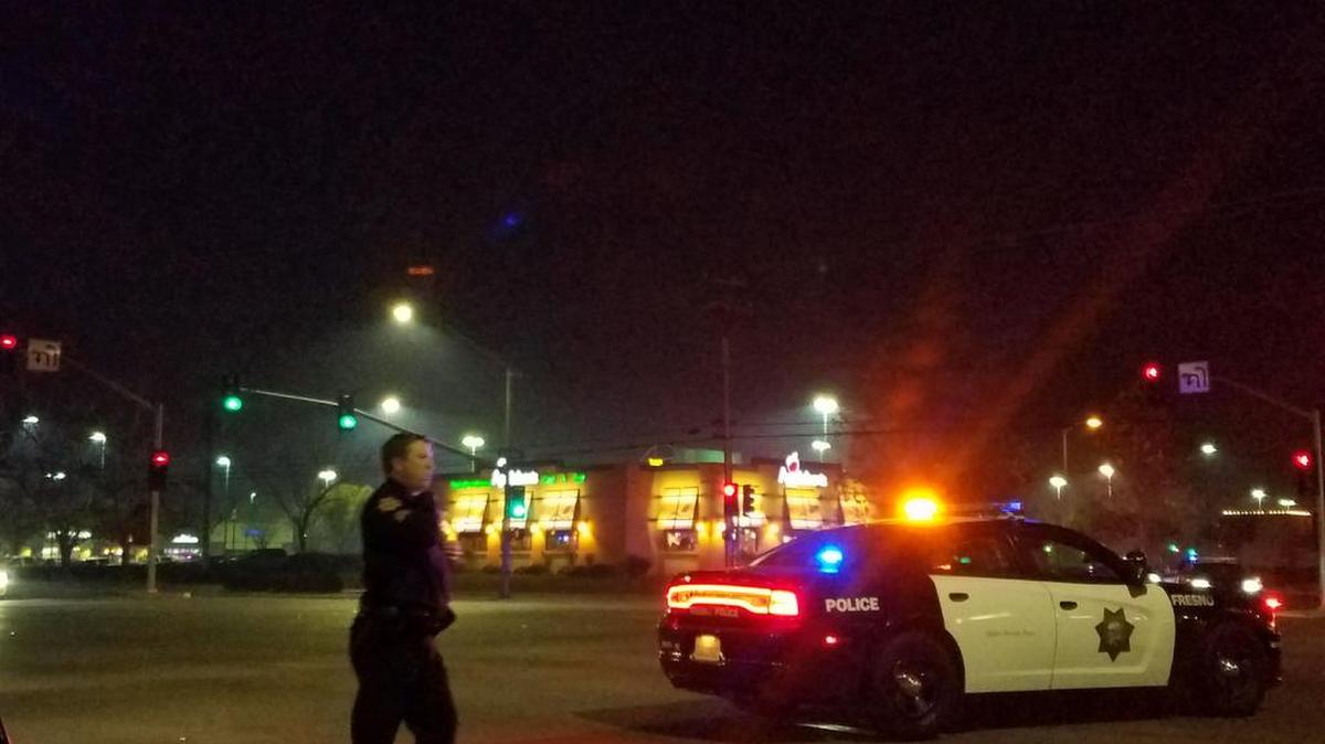 Police directed traffic at the intersection of Herndon and Cedar avenues in Fresno on Friday, Feb. 2, 2018, after a woman was hit by a vehicle.