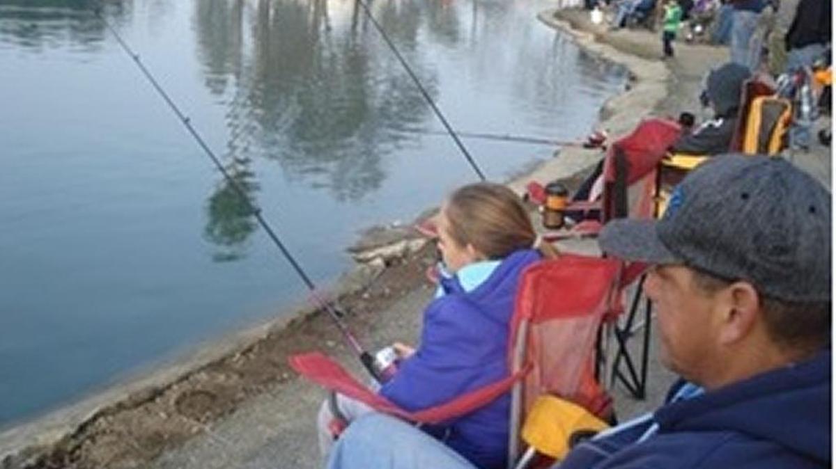 Participants cast their lines in the water at a recent Winter Trout Derby in Visalia.