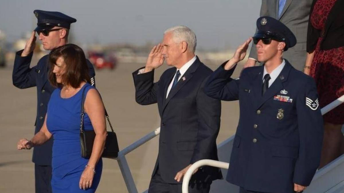 Vice President Mike Pence salutes upon his arrival at Mather Airport. Pence attended a tax relief event in Rancho Cordova and was accompanied by his wife, Karen, Congressman Kevin McCarthy and his wife Judy.