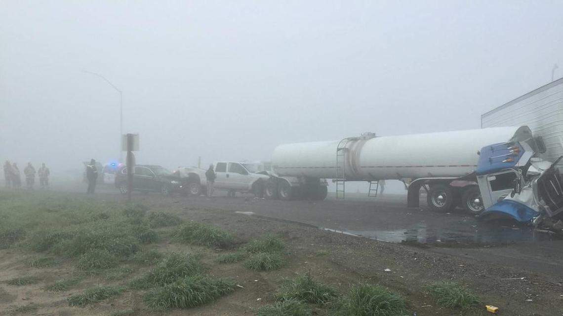 Some big rigs and other vehicles tangled in the fog near Hanford in 2017.